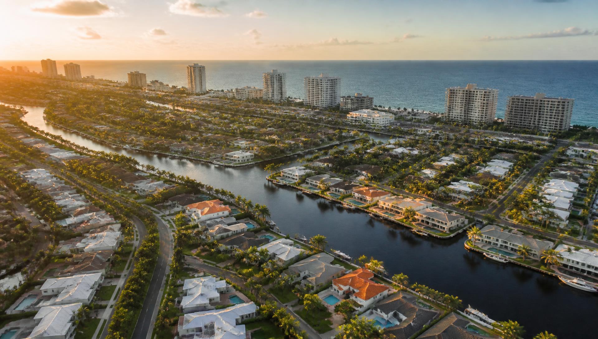 Aerial view of South Florida waterfront homes and condominiums at golden hour